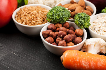 Fresh raw vegetables with nuts and cereals for cooking or eating. Vegetarian food.