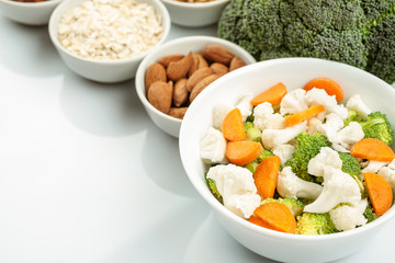 Fresh raw vegetables with nuts and cereals for cooking or eating. Vegetarian food.
