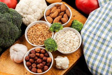 Fresh raw vegetables with nuts and cereals for cooking or eating. Vegetarian food. Top view