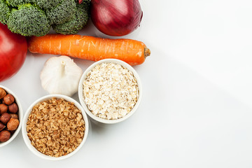 Fresh raw vegetables with nuts and cereals for cooking or eating. Vegetarian food. Top view