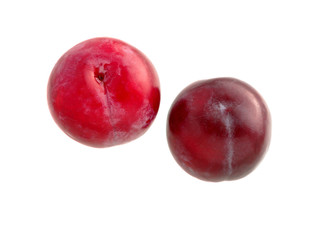 Fototapeta na wymiar Sweet plum. Two red plums isolated on white. Ripe plum fruit
