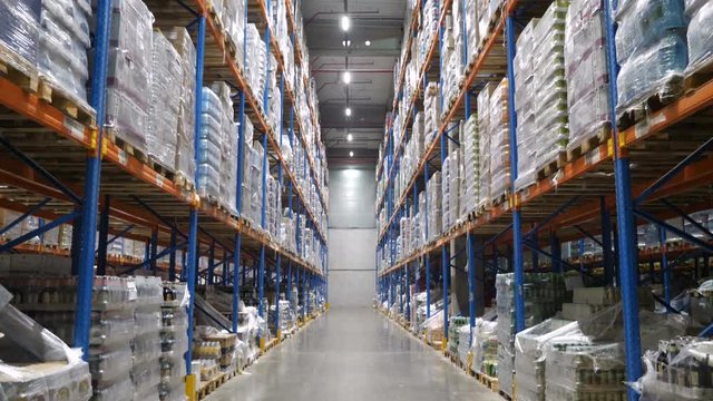 Multi Level warehouse with cardboard boxes arranged on the racks