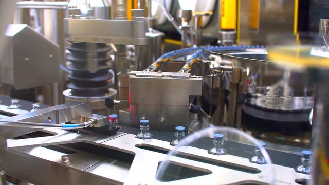 Pharmaceutical manufacturing line at factory. Pharmaceutical quality control.