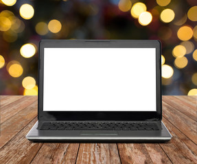 laptop with white screen over christmas lights