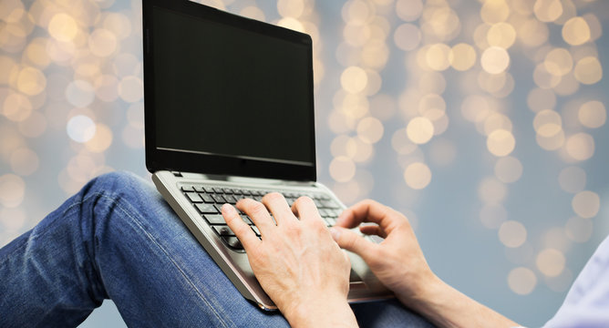 close up of man typing on laptop keyboard