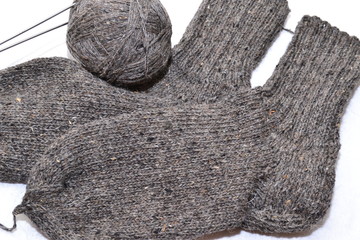 Wool cocks and knitting needles.