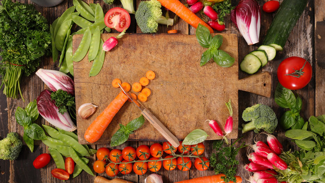 wooden board with fresh vegetables