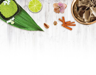 Spa mud and fruits on wooden table background