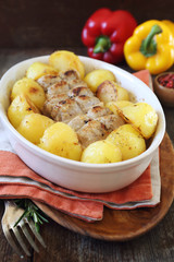 Stewed meat paupiettes with potatoes in ceramic bakeware