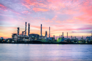 Obraz na płótnie Canvas Oil Refinery Industry Plant at dramatic colorful sunrise dawn sky background.