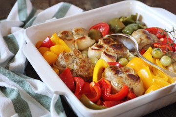 Braised meat paupiettes with bell peppers in ceramic bakeware
