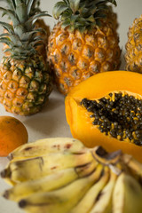 Fototapeta na wymiar Papaya, pineapple, mango, bananas, exotic fruits.