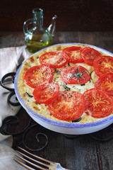 Zucchini tomatoes gratin with bechamel sauce and cheese