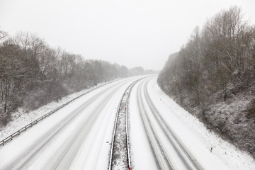 Highway during a snowstorm in winter