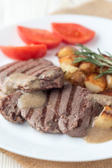 Gourmet grilled steak with rosemary and fried potato