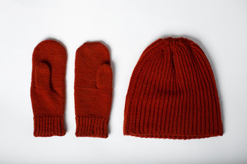 knitted hat with gloves red on a white background