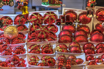 Beautiful colorful Christmas tree balls with attractive designs offered at a booth on a Christmas market. Concept: holidays, christmas