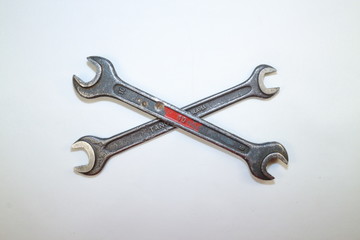 tools for work, two steel spanners in different positions on a white background