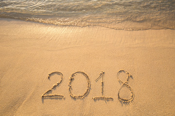 The inscription on the sand in 2018, which washes off a wave.