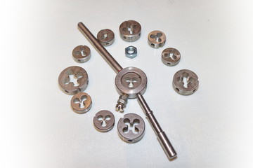 Tool for threading in holes and stilettos on a white background