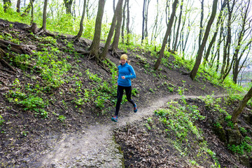 Obraz premium Girl running in the woods..