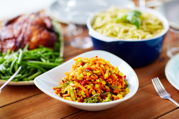 vegetable salad with corn and other food on table