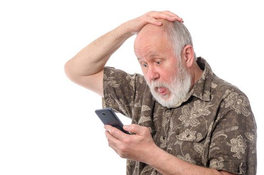 senior man surprized with something at mobile smartphone, isolated on white