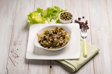 sauteed endive salad with caper dried grape and date fruit