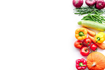 Colorful vegetables for healthy diet. Paprika, tomatoes, carrot, zucchini, eggplant on white background top view copyspace