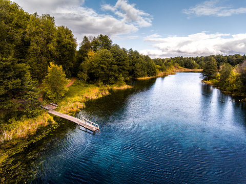 Aerial view of the karst lake named Goluboye Ozero (Blue Lake) surrounded by forest. Maximum depth is 18m (60ft). Lake is situated near the city of Kazan, Russia