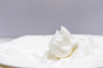 Moisturizing cream in an open jar. Close-up view.