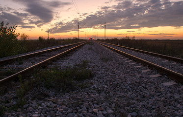 Fototapeta na wymiar Railway into sunset