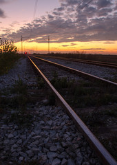 Fototapeta na wymiar Railway into sunset