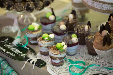 Wedding cake with cupcakes at the exhibition