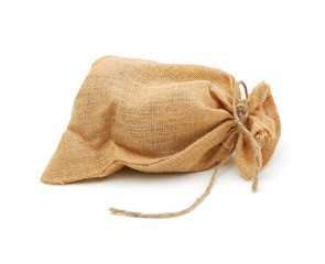 Hessian sack with ties forming over white background.