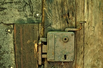 Rusty lock of one Baza 20 house Kocevski rog - obrazy, fototapety, plakaty