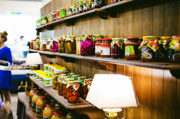 canned vegetables, salted foods in a glass jar, on a shelf