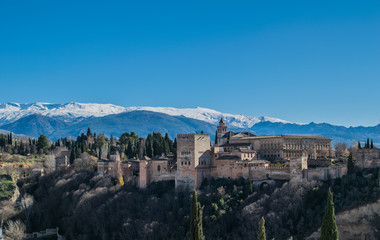 Fototapeta na wymiar a view of Alhambra in Granada, Spain with Sierra nevada in the background covered in snow