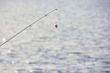 Fototapeta premium float with fishing rod
