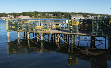 Pier full of lobster traps over Bass Harbor Maine