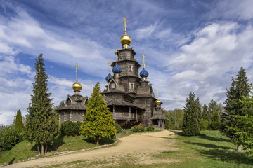 Fototapeta na wymiar ancient wooden Russian orthodox church ad summer day