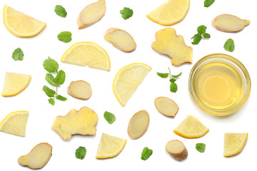 healthy background. sliced ginger, honey and lemon isolated on white background top view