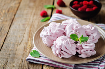 Obraz na płótnie Canvas Raspberry Zephyr on a plate with fresh raspberries and mint