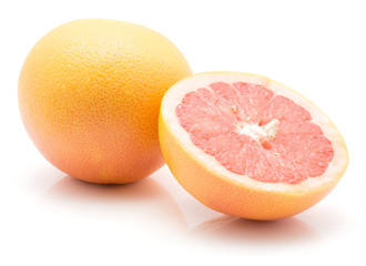 Red grapefruit isolated on white background one whole and one cross section half.