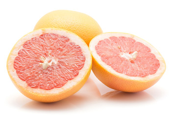 Red grapefruit isolated on white background one whole and two cross section halves.