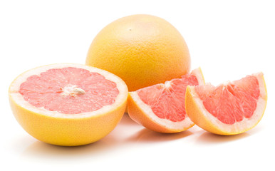 Red grapefruit isolated on white background one whole one cross section half and two slices.