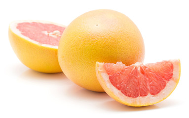 Red grapefruit isolated on white background one whole half and slice.
