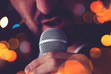 Man sings karaoke in a bar