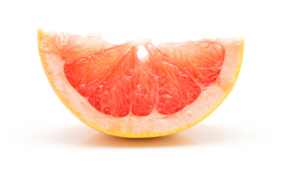 Red grapefruit slice isolated on white background.