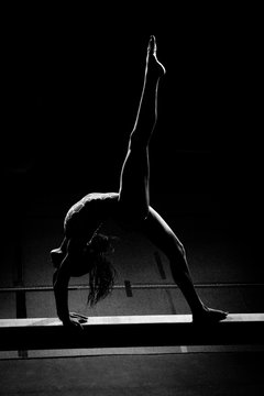 Silhouetted Black Gymnast in Back Walkover
